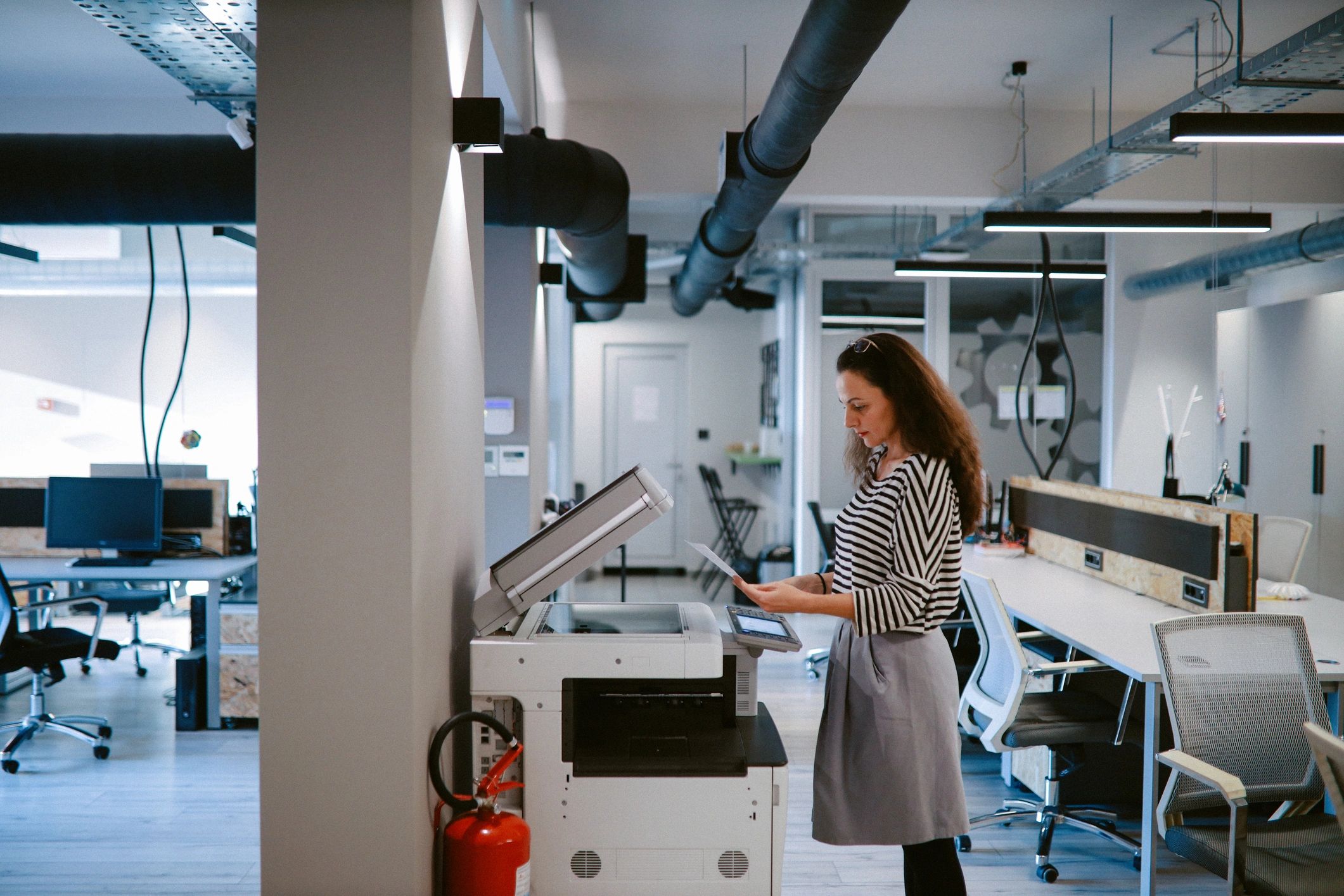 Person using an office photocopier